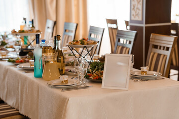 Elegant Wedding Reception Table Setting with White Linen, Salad Bowls, Place Cards, and Water Bottles Neutral Tone Celebration.