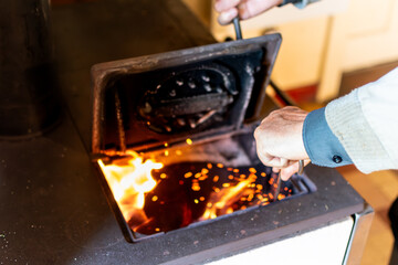 Wood stove in a house for heating and cooking, real life photo