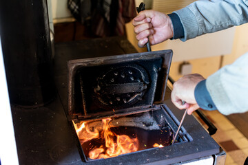 Wood stove in a house for heating and cooking, real life photo