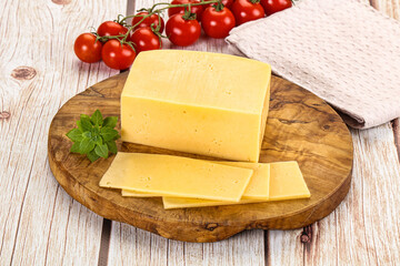 Yellow cheese piece with slices