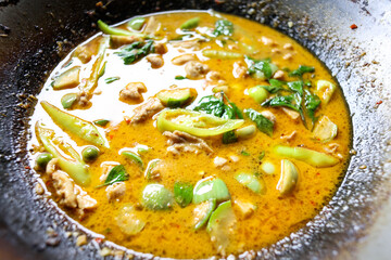 Thai food. Chicken green curry with eggplant.