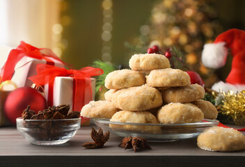 Detail of anise cookies on wooden table in living room