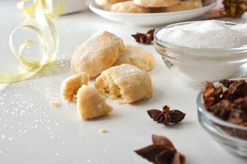 Tasting of anise and sugar cookies on table with ingredients