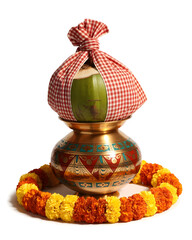 Ornate kalash with mango leaves and festive garland studio photograph