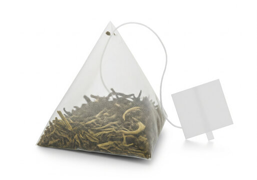 Triangle Green Tea Bag with Empty Label Isolated on White Background.