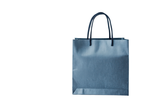 Shiny blue gift bag with handles isolated on transparent background. Blue shopping bag standing on white background.