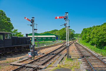 Old heritage diesel train on tracks in rural countryside setting