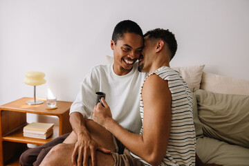 Happy couple sharing a joyful moment together in a cozy living space