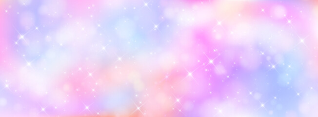Fototapeta premium Unicorn magical bokeh background with pastel rainbow gradient and sparkling stars for fantasy design. Soft pink, purple and blue colors with glowing light effects. Dreamy fairy tale atmosphere.