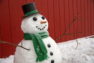 Frosty Friend: A jovial snowman, adorned with a top hat and scarf, stands proudly against a rustic backdrop, embodying the whimsical charm of winter.
