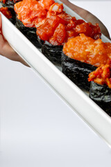 Nigiri with red fish on a white background isolated for menu
