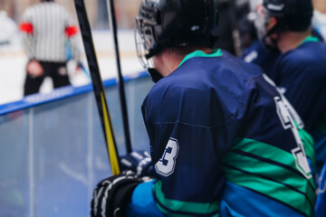 Hockey match game on ice rink arena stadium, team of ice hockey professional players with coach, stick and puck, team of hockey players in protective sport uniform training, hockey league championship