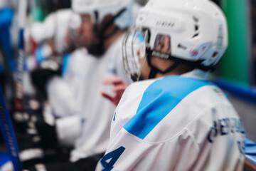 Fototapeta premium Hockey match game on ice rink arena stadium, team of ice hockey professional players with coach, stick and puck, team of hockey players in protective sport uniform training, hockey league championship