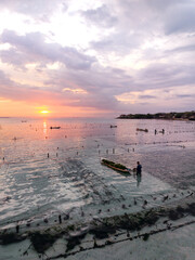 Fototapeta premium Sunset in Indonesia Bali at Seaweed harvest 