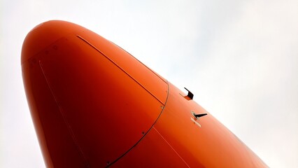 Close-up view of an aircraft radome showing the static tube and angle of attack sensor on the nose section