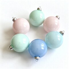 Glossy pastel-colored baubles arranged in a circle on white background, offering a soft and modern touch to holiday decor.
