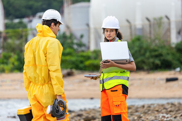 Environmental Engineers Conducting Site Inspection at Industrial Coastline, Safety Officer and...