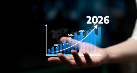 A hand holding a futuristic bar graph representing business growth forecasts from 2023 to 2026. This image highlights trend analysis, financial forecasting, and entrepreneurial success. Tessel