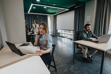 Collaborative workspace showcasing team interactions and concentration, highlighting modern...