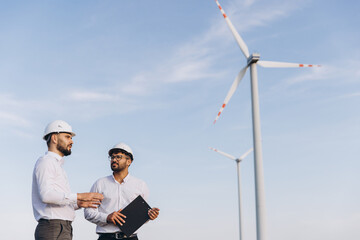 Engineers discussing about a wind turbine project