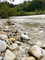 Close-up of a turbulent mountain river with a rocky bottom and shore.