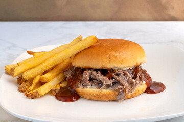 steak sandwich with a side of french  fries