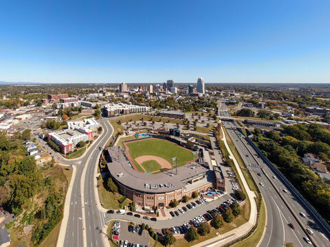 Sunny Daytime Drone Images of Truist Stadium, Home of the Winston-Salem Dash, with Downtown Skyline