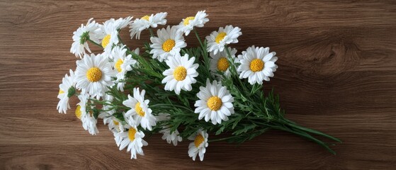 The daisy bouquet on rustic wooden table with bright natural light