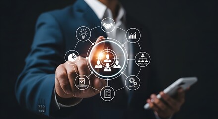 Businessman touching a digital interface with icons representing team management, strategy, and business growth, symbolizing organizational structure and success