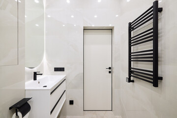 Discover the beauty of a modern bathroom design featuring stylish black accents and sleek fixtures