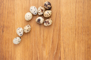 Quail eggs on wooden surface

