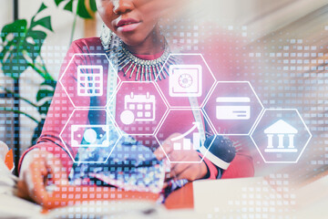 Professional woman engaging in financial planning and analysis with digital tools in a modern office setting