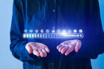 Hands holding a glowing update progress bar showing 85 percent completion during a digital technology advancement presentation