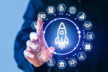 Hand manipulating digital interface with rocket symbol representing innovation and growth in technology