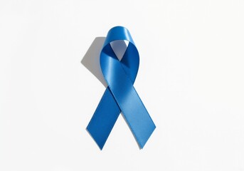 Blue awareness ribbon on a white background. Symbol for meningitis and prostate cancer awareness. Health campaign concept with copy space