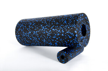 Massage set: Blue massage roller isolated on a white background. Close-up. Foam rolling is a self myofascial release technique. Concept of fitness equipment.