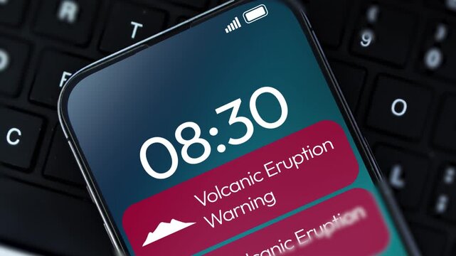 Volcano erruption warning notification appearing on the smartphone screen close up, 4k footage. weather, climate change, mountain
