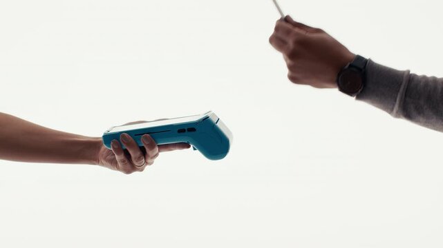 A person making a quick and easy payment using a modern credit card terminal