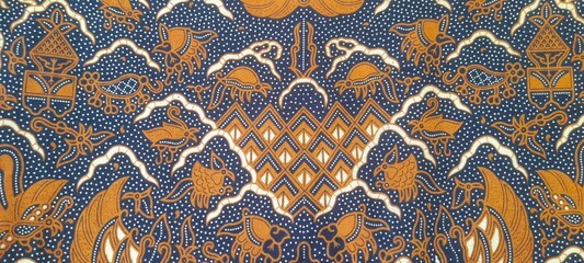 Traditional batik pattern with brown and navy blue tones featuring floral and animal motifs. Batik Cuwiri. Perfect for textile, background, cultural, and ethnic design projects.