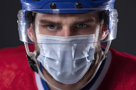 Hockey Coronavirus: Player wearing Face Mask and Helmet on Ice