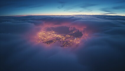 Fototapeta premium Cluster of city lights glowing through cloud break at high-altitude aerial viewpoint, twilight sky