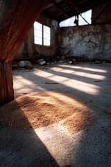 Obraz premium Sunlit shadows in an abandoned warehouse with rustic textures.