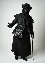 Fototapeta premium Plague Doctor Full length walking Silhouette Portrait of Gothic Halloween Character with Beak Mask, Black Cloak on White Studio Background, Dramatic Dark Costume and Fantasy Horror figure