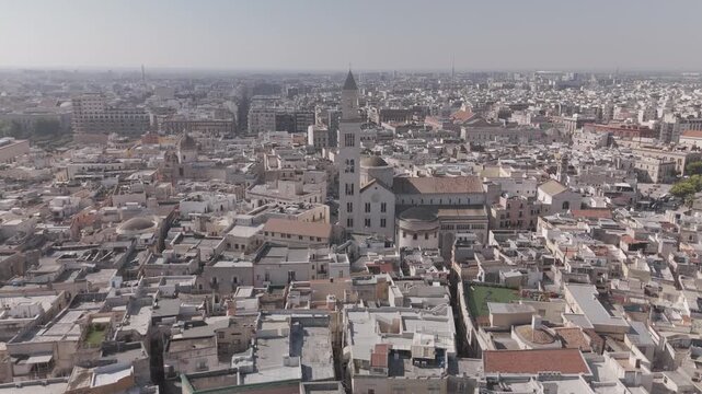 Summer aerial view of Greek coastal town with church and turquoise sea
