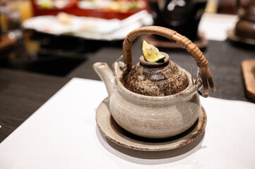 Traditional Japanese Teapot with Kabosu Garnish – Rustic Ceramic Dobin for Tea or Broth Presentation