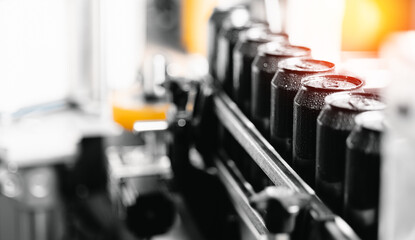 Industrial beer canning process in modern brewery factory with equipment and machinery, sunlight