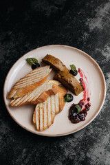 Grilled toast with plate and berry sauce on rustic plate