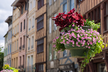 Hanging baskets with flowers in the streets of Rouen in Normandy in France