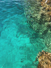 Crystal Blue Surface of the Red Sea with Corals Below