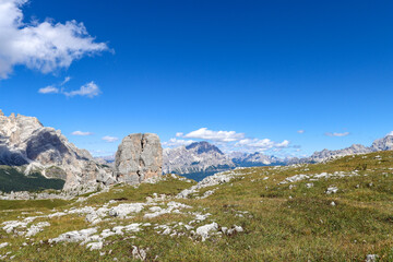 Fototapeta premium A cathedral of rock and sky—Cinque Torri watches over the highlands in quiet majesty